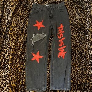 Black Jeans with Red Stars and Text